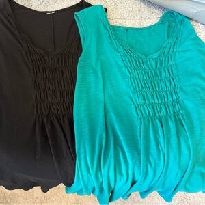 Two Women's Black and Teal Sleeveless Tops